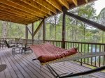 Covered lower porch overlooking lake